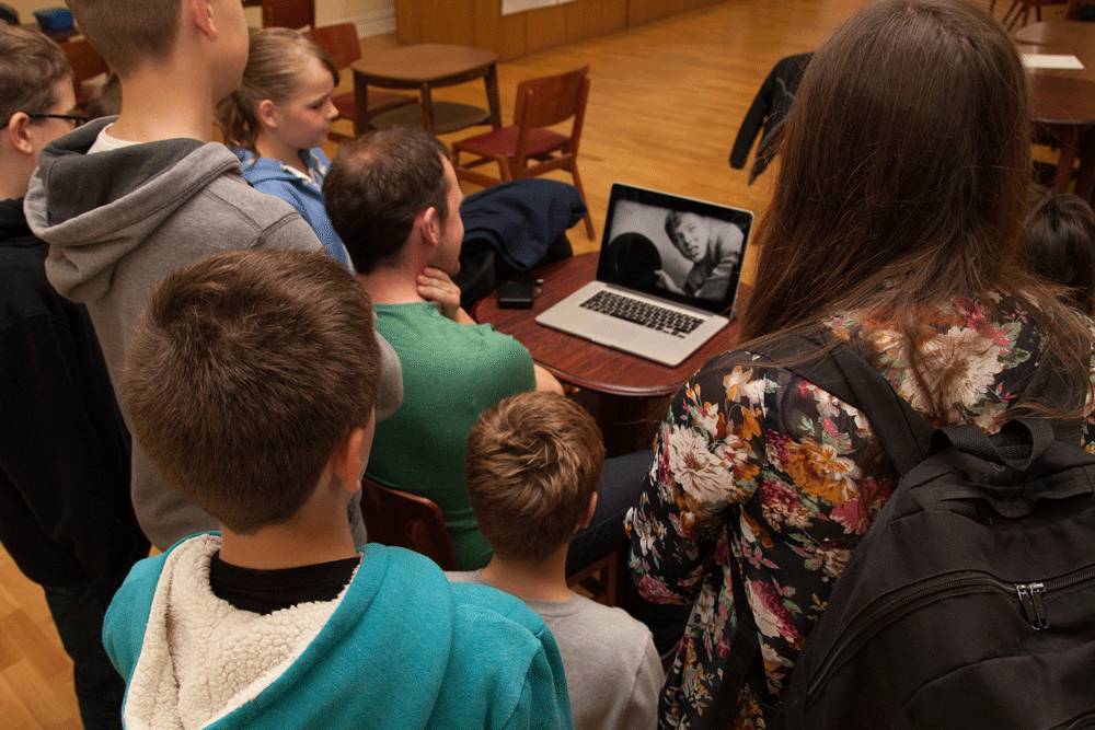 GB, WALES. Memo Newbridge Memorial Hall. After a hasty edit, Zoom Cymru show the Artsparkers their edited short films before they go home. 2015. © Kate Mercer / https://katemercer.co.uk